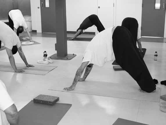 Paul Yapp teaching yoga to inmates